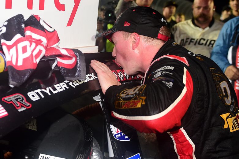 HOMESTEAD, FLORIDA - NOVEMBER 16: Tyler Reddick, driver of the #2 Tame the Beast Chevrolet, kisses the winner's decal on his car in Victory Lane after winning the NASCAR Xfinity Series Ford EcoBoost 300 and the NASCAR Xfinity Series Championship at Homestead-Miami Speedway on November 16, 2019 in Homestead, Florida. (Photo by Jared C. Tilton/Getty Images) | Getty Images