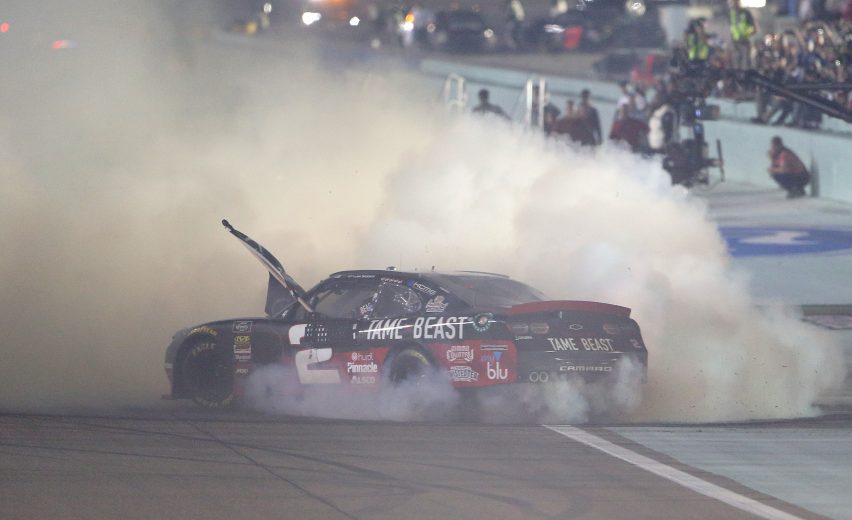 HOMESTEAD, FLORIDA - NOVEMBER 16: Tyler Reddick, driver of the #2 Tame the Beast Chevrolet, celebrates after winning the NASCAR Xfinity Series Ford EcoBoost 300 and the NASCAR Xfinity Series Championship at Homestead-Miami Speedway on November 16, 2019 in Homestead, Florida. (Photo by Brian Lawdermilk/Getty Images) | Getty Images