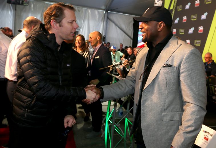 HOMESTEAD, FLORIDA - NOVEMBER 17: Brad Keselowski, driver of the #2 Discount Tire Ford, shakes hands with Ray Lewis during the driver's meeting prior to the Monster Energy NASCAR Cup Series Ford EcoBoost 400 at Homestead Speedway on November 17, 2019 in Homestead, Florida. (Photo by Brian Lawdermilk/Getty Images) | Getty Images