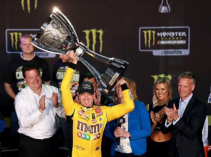 HOMESTEAD, FLORIDA - NOVEMBER 17: Kyle Busch, driver of the #18 M&M's Toyota, celebrates in victory lane after winning the Monster Energy NASCAR Cup Series Championship and the Monster Energy NASCAR Cup Series Ford EcoBoost 400 at Homestead Speedway on November 17, 2019 in Homestead, Florida. (Photo by Sean Gardner/Getty Images) | Getty Images