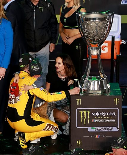 HOMESTEAD, FLORIDA - NOVEMBER 17: Kyle Busch, driver of the #18 M&M's Toyota, celebrates with his son Brexton and wife Samantha in victory lane after winning the Monster Energy NASCAR Cup Series Championship and the Monster Energy NASCAR Cup Series Ford EcoBoost 400 at Homestead Speedway on November 17, 2019 in Homestead, Florida. (Photo by Sean Gardner/Getty Images) | Getty Images