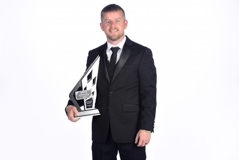 CHARLOTTE, NORTH CAROLINA - NOVEMBER 22: Justin Allgaier, NASCAR Xfinity Series driver, poses with the fourth place trophy during the NASCAR Xfinity Series and NASCAR Gander Outdoors Truck Series Championship Banquet at Charlotte Convention Center on November 22, 2019 in Charlotte, North Carolina. (Photo by Jared C. Tilton/Getty Images) | Getty Images