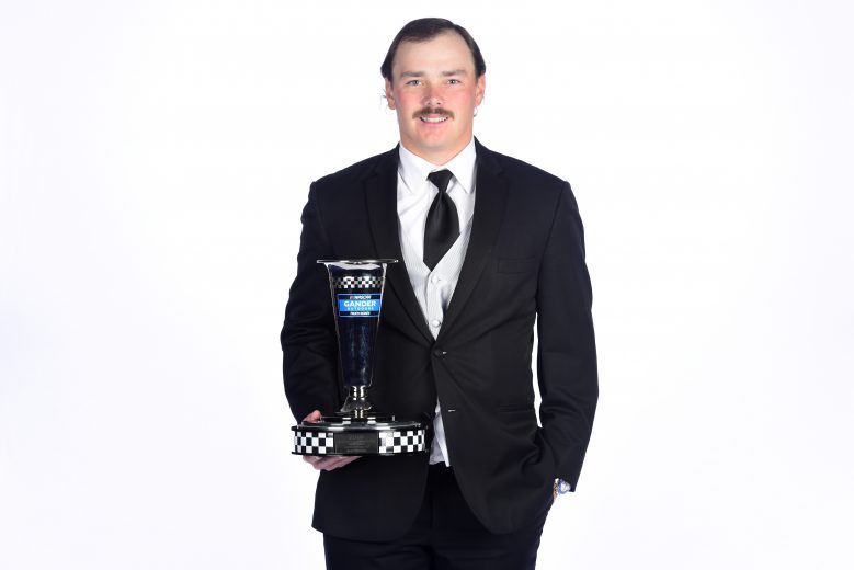 CHARLOTTE, NORTH CAROLINA - NOVEMBER 22: Brett Moffitt, NASCAR Gander Outdoors Truck Series driver, poses with the third place trophy during the NASCAR Xfinity Series and NASCAR Gander Outdoors Truck Series Championship Banquet at Charlotte Convention Center on November 22, 2019 in Charlotte, North Carolina. (Photo by Jared C. Tilton/Getty Images) | Getty Images