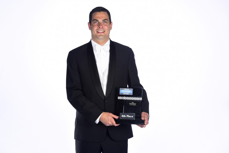 CHARLOTTE, NORTH CAROLINA - NOVEMBER 22: Stewart Friesen, NASCAR Gander Outdoors Truck Series driver, poses with the fourth place trophy during the NASCAR Xfinity Series and NASCAR Gander Outdoors Truck Series Championship Banquet at Charlotte Convention Center on November 22, 2019 in Charlotte, North Carolina. (Photo by Jared C. Tilton/Getty Images) | Getty Images