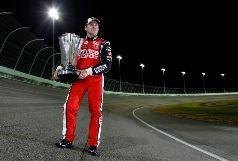 HOMESTEAD, FL - NOVEMBER 21: Tony Stewart, driver of the #14 Office Depot/Mobil 1 Chevrolet, poses with the Championship trophy after winning the NASCAR Sprint Cup Series Ford 400 and the 2011 Series Championship at Homestead-Miami Speedway on November 21, 2011 in Homestead, Florida. (Photo by Chris Graythen/Getty Images) | Getty Images
