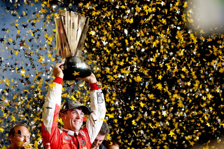 HOMESTEAD, FL - NOVEMBER 16: Kevin Harvick, driver of the #4 Budweiser Chevrolet, celebrates with the trophy in Victory Lane after winning the NASCAR Sprint Cup Series Ford EcoBoost 400 and the NASCAR Sprint Cup Series Championship at Homestead-Miami Speedway on November 16, 2014 in Homestead, Florida. (Photo by Sean Gardner/Getty Images) | Getty Images