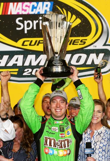 HOMESTEAD, FL - NOVEMBER 22: Kyle Busch, driver of the #18 M&M's Crispy Toyota, celebrates with the trophy in Victory Lane after winning the series championship and the NASCAR Sprint Cup Series Ford EcoBoost 400 at Homestead-Miami Speedway on November 22, 2015 in Homestead, Florida. (Photo by Sarah Crabill/Getty Images) | Getty Images