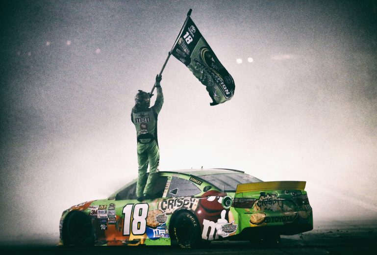 HOMESTEAD, FL - NOVEMBER 22: (EDITOR'S NOTE: Image was processed using digital filters.) Kyle Busch, driver of the #18 M&M's Crispy Toyota, celebrates winning the series championship and the NASCAR Sprint Cup Series Ford EcoBoost 400 at Homestead-Miami Speedway on November 22, 2015 in Homestead, Florida. (Photo by Mike Ehrmann/Getty Images) | Getty Images