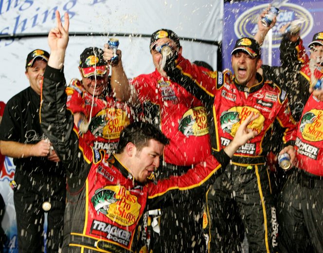 HOMESTEAD, FL - NOVEMBER 19: Martin Truex Jr., driver of the #8 Bass Pro Shops/TRACKER Chevrolet, celebrates after winning the NASCAR Busch Series Championship at the Ford 300 on November 19, 2005 at Homestead Miami Speedway in Homestead, Florida. (Photo By Streeter Lecka/Getty Images) | Getty Images