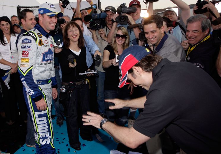 AVONDALE, AZ - NOVEMBER 11: (R) Jeff Gordon, driver of the #24 DuPont Chevrolet, bows to Jimmie Johnson, driver of the #48 Lowe's Chevrolet, after Johnson won the NASCAR Nextel Cup Series Checker Auto Parts 500 at Phoenix International Raceway on November 11, 2007 in Avondale, Arizona. (Photo by John Harrelson/Getty Images for NASCAR) | Getty Images