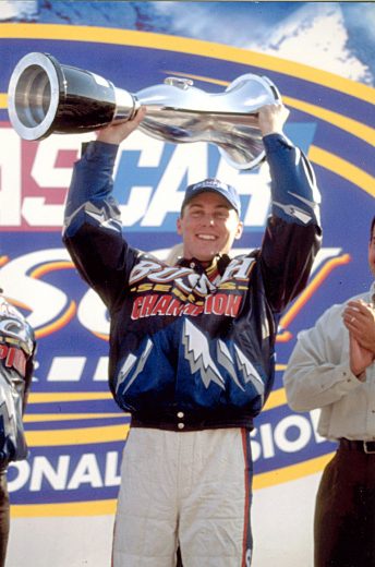 2001: Kevin Harvick celebrates with his 2001 NASCAR Busch Series championship trophy. (Photo by ISC Archives/CQ-Roll Call Group via Getty Images)