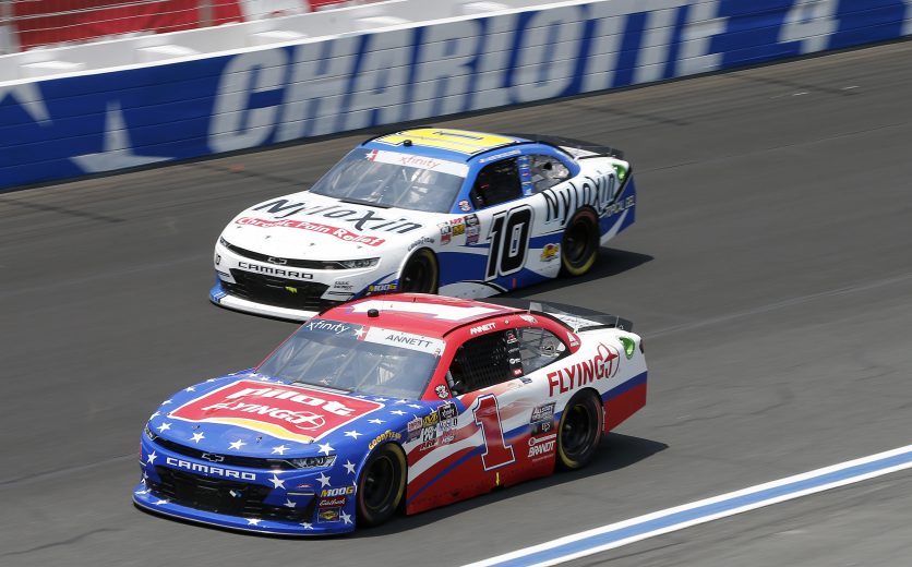 CHARLOTTE, NORTH CAROLINA - MAY 25: Michael Annett, driver of the #1 Pilot/Flying J Chevrolet, races, Austin Dillon, driver of the #10 Nyloxin Chronic Pain Relief Chevrolet, during the NASCAR Xfinity Series Alsco 300 at Charlotte Motor Speedway on May 25, 2019 in Charlotte, North Carolina. (Photo by Brian Lawdermilk/Getty Images) | Getty Images