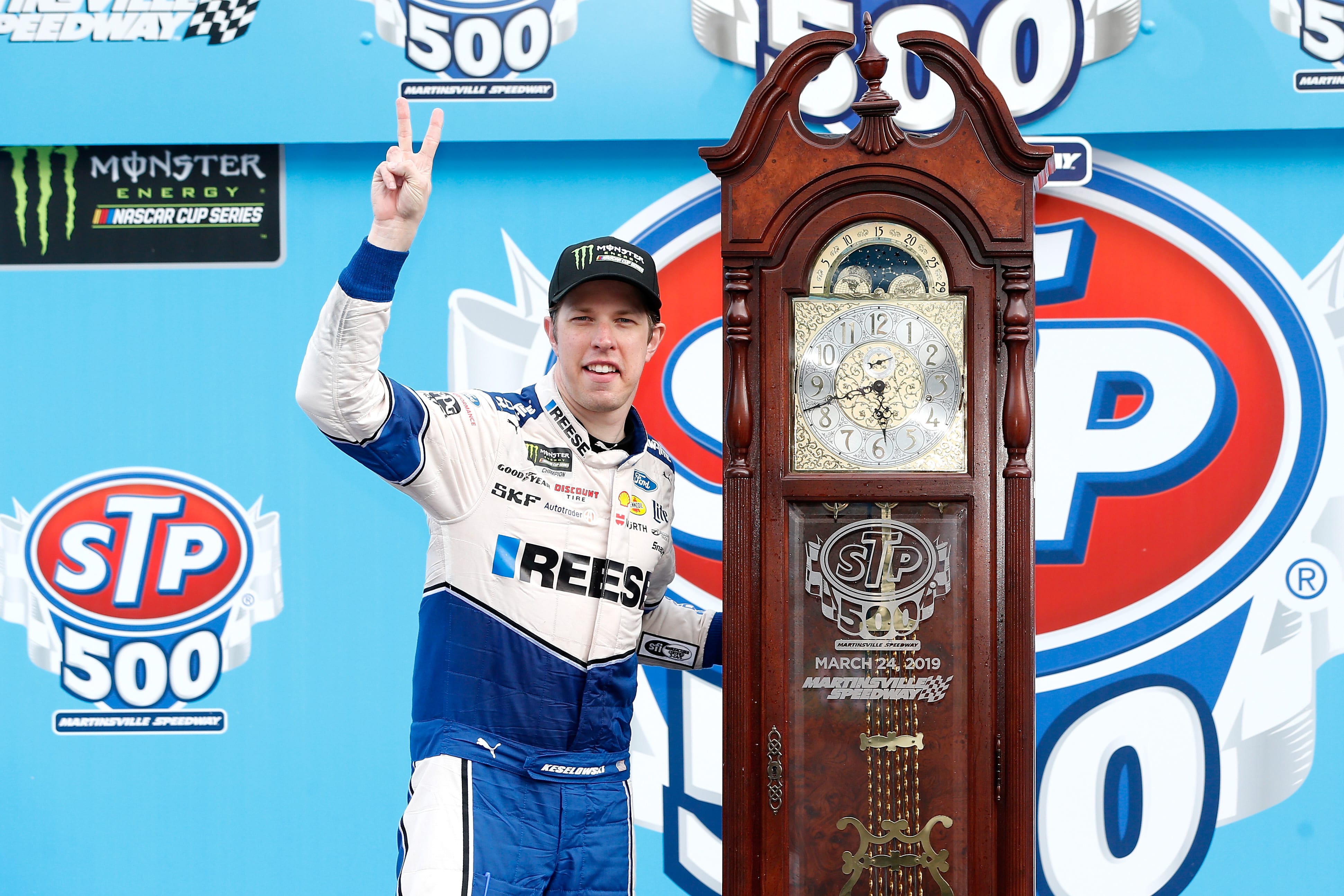 MARTINSVILLE, VA - MARCH 24:  Brad Keselowski, driver of the #2 Reese/Draw Tite Ford, poses with the trophy in Victory Lane after winning the Monster Energy NASCAR Cup Series STP 500 at Martinsville Speedway on March 24, 2019 in Martinsville, Virginia.  (Photo by Brian Lawdermilk/Getty Images) | Getty Images