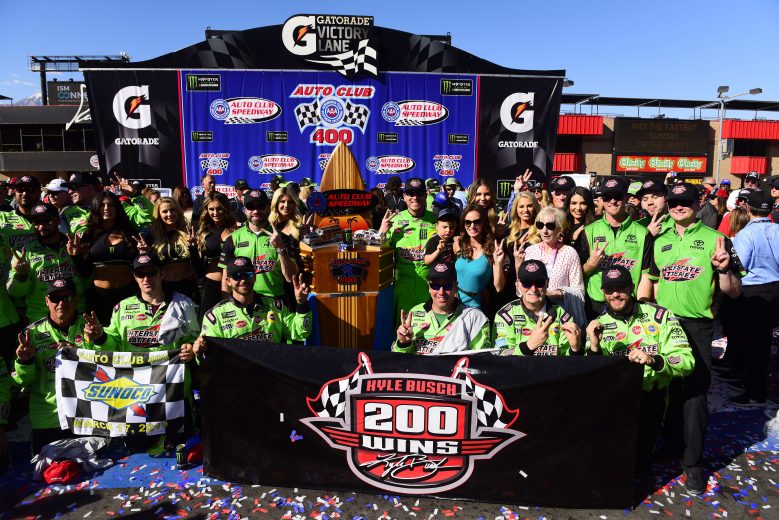 FONTANA, CALIFORNIA - MARCH 17: Kyle Busch, driver of the #18 Interstate Batteries Toyota, celebrates in victory lane after winning the Monster Energy NASCAR Cup Series Auto Club 400 and winning his 200th NASCAR race at Auto Club Speedway on March 17, 2019 in Fontana, California. (Photo by Jared C. Tilton/Getty Images) | Getty Images