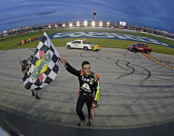 JOLIET, ILLINOIS - JUNE 30: Alex Bowman, driver of the #88 Axalta Chevrolet, waves the checkered flag after winning the Monster Energy NASCAR Cup Series Camping World 400 at Chicagoland Speedway on June 30, 2019 in Joliet, Illinois. (Photo by Jonathan Daniel/Getty Images) | Getty Images