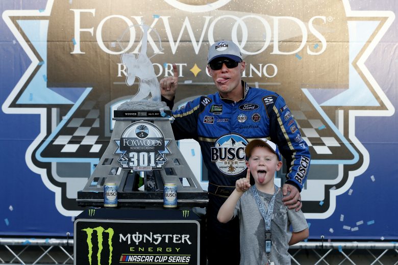 LOUDON, NEW HAMPSHIRE - JULY 21: Kevin Harvick, driver of the #4 Busch Beer/National Forest Foundation Ford, celebrates with his son Keelan in Victory Lane after winning the Monster Energy NASCAR Cup Series Foxwoods Resort Casino 301 at New Hampshire Motor Speedway on July 21, 2019 in Loudon, New Hampshire. (Photo by Brian Lawdermilk/Getty Images) | Getty Images
