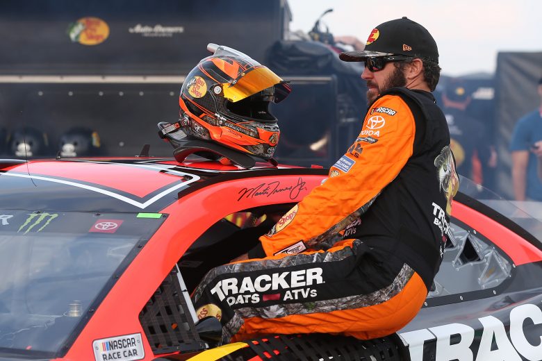 WATKINS GLEN, NEW YORK - AUGUST 03: Martin Truex Jr, driver of the #19 Bass Pro Shops Toyota, gets into his car during qualifying for the Monster Energy NASCAR Cup Series Go Bowling at The Glen at Watkins Glen International on August 03, 2019 in Watkins Glen, New York. (Photo by Matt Sullivan/Getty Images) | Getty Images