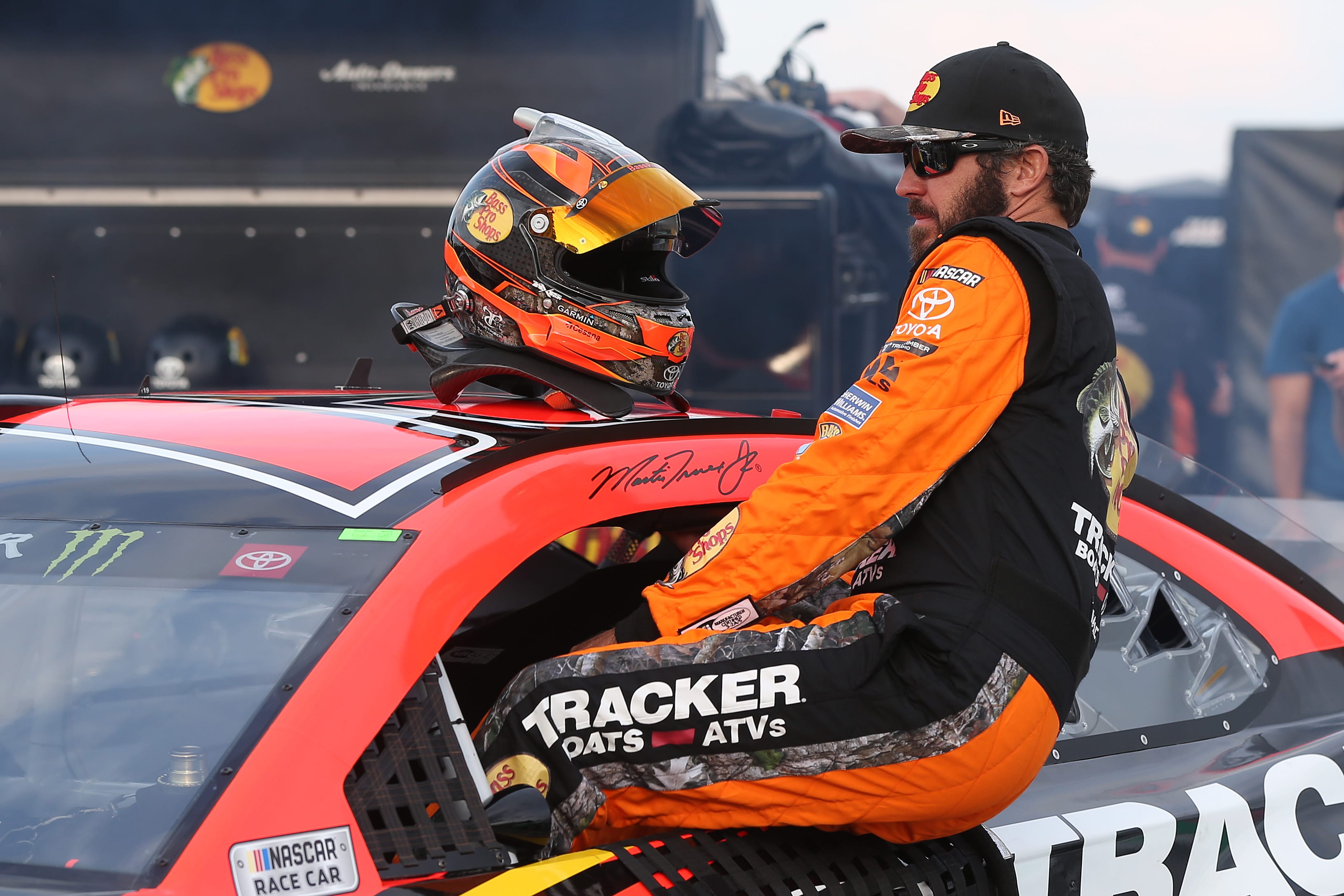 WATKINS GLEN, NEW YORK - AUGUST 03: Martin Truex Jr, driver of the #19 Bass Pro Shops Toyota, gets into his car during qualifying for the Monster Energy NASCAR Cup Series Go Bowling at The Glen at Watkins Glen International on August 03, 2019 in Watkins Glen, New York. (Photo by Matt Sullivan/Getty Images) | Getty Images