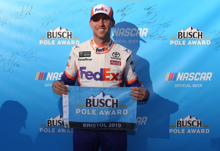 BRISTOL, TENNESSEE - AUGUST 16: Denny Hamlin, driver of the #11 FedEx Freight Toyota, celebrates with the Pole Award qualifying for the Monster Energy NASCAR Cup Series Bass Pro Shops NRA Night Race at Bristol Motor Speedway on August 16, 2019 in Bristol, Tennessee. (Photo by Brian Lawdermilk/Getty Images) | Getty Images