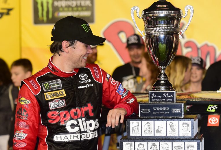 DARLINGTON, SOUTH CAROLINA - SEPTEMBER 02: Erik Jones, driver of the #20 Sport Clips Throwback Toyota, celebrates in Victory Lane after winning the Monster Energy NASCAR Cup Series Bojangles' Southern 500 at Darlington Raceway on September 02, 2019 in Darlington, South Carolina. (Photo by Jared C. Tilton/Getty Images) | Getty Images