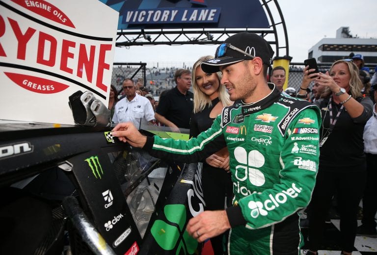 DOVER, DELAWARE - OCTOBER 06: Kyle Larson, driver of the #42 Clover Chevrolet, poses with the winners sticker in Victory Lane after the Monster Energy NASCAR Cup Series Drydene 400 at Dover International Speedway on October 06, 2019 in Dover, Delaware. (Photo by Matt Sullivan/Getty Images) | Getty Images