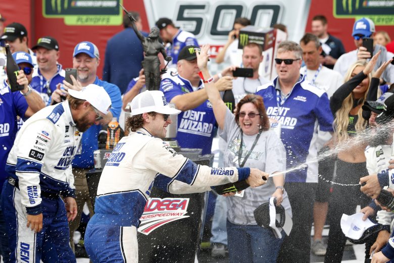 TALLADEGA, ALABAMA - OCTOBER 14: Ryan Blaney, driver of the #12 Dent Wizard Ford, and his team celebrate in Victory Lane after winning the Monster Energy NASCAR Cup Series 1000Bulbs.com 500 at Talladega Superspeedway on October 14, 2019 in Talladega, Alabama. (Photo by Brian Lawdermilk/Getty Images) | Getty Images