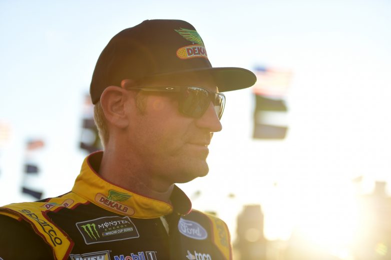 KANSAS CITY, KANSAS - OCTOBER 18: Clint Bowyer, driver of the #14 DEKALB Ford, stands in the garage area during practice for the Monster Energy NASCAR Cup Series Hollywood Casino 400 at Kansas Speedway on October 18, 2019 in Kansas City, Kansas. (Photo by Jared C. Tilton/Getty Images) | Getty Images