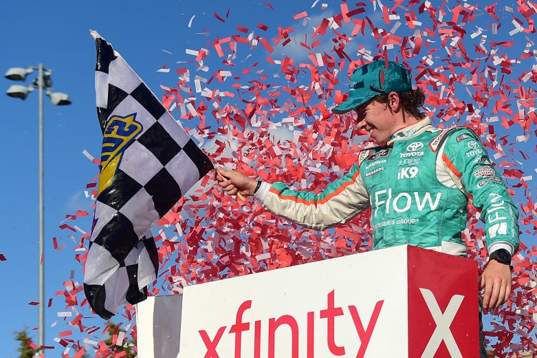 KANSAS CITY, KANSAS - OCTOBER 19: Brandon Jones, driver of the #19 Flow Toyota, celebrates in Victory Lane after winning the NASCAR Xfinity Series Kansas Lottery 300 at Kansas Speedway on October 19, 2019 in Kansas City, Kansas. (Photo by Jared C. Tilton/Getty Images) | Getty Images