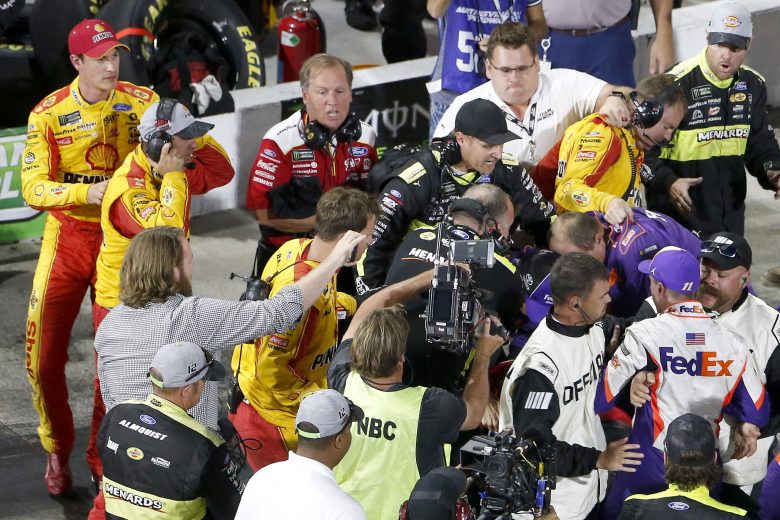 MARTINSVILLE, VIRGINIA - OCTOBER 27: Denny Hamlin, driver of the #11 FedEx Freight Toyota, Joey Logano, driver of the #22 Shell Pennzoil Ford, and their crews have an altercation on pit lane following the Monster Energy NASCAR Cup Series First Data 500 at Martinsville Speedway on October 27, 2019 in Martinsville, Virginia. (Photo by Brian Lawdermilk/Getty Images) | Getty Images