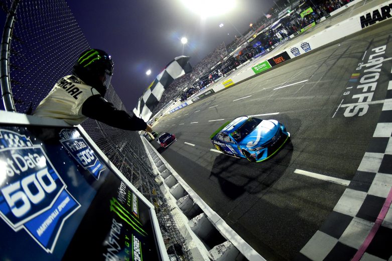MARTINSVILLE, VIRGINIA - OCTOBER 27: Martin Truex Jr, driver of the #19 Auto Owners Insurance Toyota, takes the checkered flag to win the Monster Energy NASCAR Cup Series First Data 500 at Martinsville Speedway on October 27, 2019 in Martinsville, Virginia. (Photo by Jared C. Tilton/Getty Images) | Getty Images