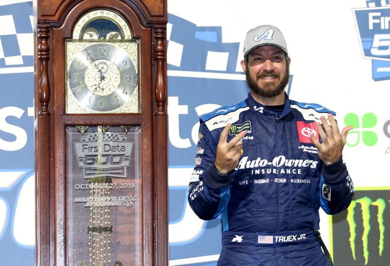 MARTINSVILLE, VIRGINIA - OCTOBER 27: Martin Truex Jr, driver of the #19 Auto Owners Insurance Toyota, poses with the trophy in Victory Lane after winning the Monster Energy NASCAR Cup Series First Data 500 at Martinsville Speedway on October 27, 2019 in Martinsville, Virginia. (Photo by Matt Sullivan/Getty Images) | Getty Images
