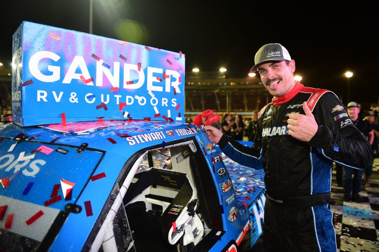 PHOENIX, ARIZONA - NOVEMBER 08: Stewart Friesen, driver of the #52 Halmar International Chevrolet, poses with the winner's sticker after his victoryduring the NASCAR Gander Outdoors Truck Series Lucas Oil 150 at ISM Raceway in Phoenix on November 08, 2019 in Phoenix, Arizona. (Photo by Jared C. Tilton/Getty Images) | Getty Images