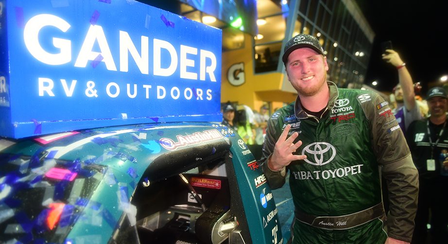 HOMESTEAD, FLORIDA - NOVEMBER 15: Austin Hill, driver of the #16 Chiba Toyopet Toyota, poses with the winner's decal on his car in Victory Lane after winning the NASCAR Gander Outdoors Truck Series Ford EcoBoost 200 at Homestead-Miami Speedway on November 15, 2019 in Homestead, Florida. (Photo by Jared C. Tilton/Getty Images) | Getty Images