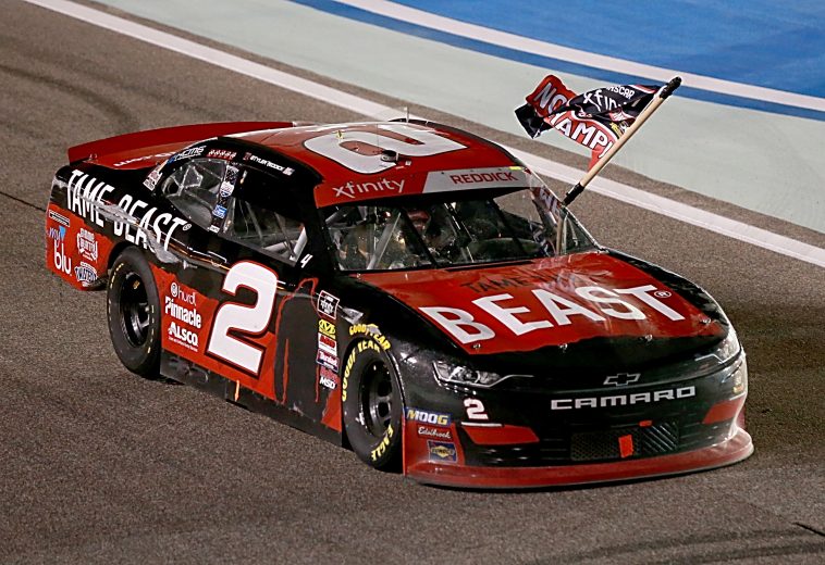 HOMESTEAD, FLORIDA - NOVEMBER 16: Tyler Reddick, driver of the #2 Tame the Beast Chevrolet, celebrates in victory lap after winning the NASCAR Xfinity Series Ford EcoBoost 300 and the NASCAR Xfinity Series Championship at Homestead-Miami Speedway on November 16, 2019 in Homestead, Florida. (Photo by Sean Gardner/Getty Images) | Getty Images