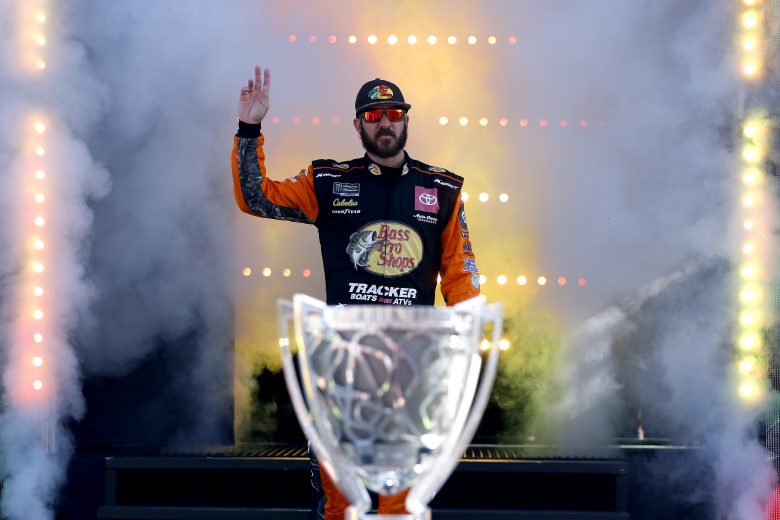 HOMESTEAD, FLORIDA - NOVEMBER 17: Martin Truex Jr., driver of the #19 Bass Pro Shops Toyota,  walks across the stage during driver introductions during the Monster Energy NASCAR Cup Series Ford EcoBoost 400 at Homestead Speedway on November 17, 2019 in Homestead, Florida. (Photo by Jonathan Ferrey/Getty Images) | Getty Images