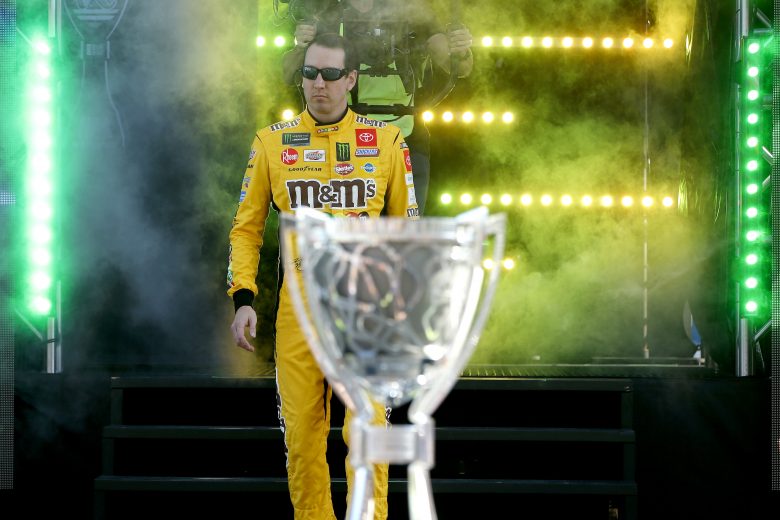 HOMESTEAD, FLORIDA - NOVEMBER 17: Kyle Busch, driver of the #18 M&M's Toyota, walks across the stage during driver introductions during the Monster Energy NASCAR Cup Series Ford EcoBoost 400 at Homestead Speedway on November 17, 2019 in Homestead, Florida. (Photo by Jonathan Ferrey/Getty Images) | Getty Images