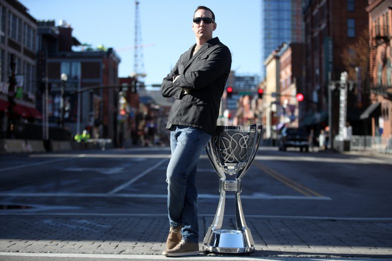 NASHVILLE, TENNESSEE - DECEMBER 04: Monster Energy NASCAR Cup Series Champion Kyle Busch poses for a photo on Broadway with the Championship Trophy on December 04, 2019 in Nashville, Tennessee. (Photo by Chris Graythen/Getty Images) | Getty Images