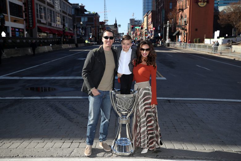 NASHVILLE, TENNESSEE - DECEMBER 04: Monster Energy NASCAR Cup Series Champion Kyle Busch, along with his wife Samantha and son Brexton pose for a photo on Broadway with the Championship Trophy on December 04, 2019 in Nashville, Tennessee. (Photo by Chris Graythen/Getty Images) | Getty Images