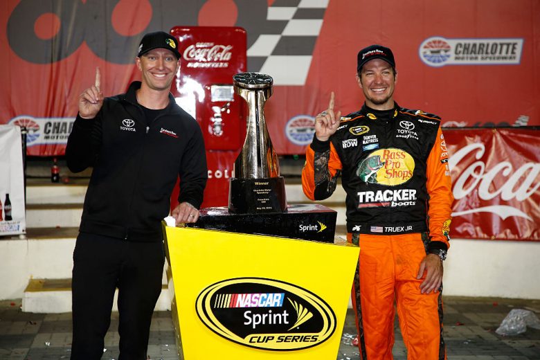 CHARLOTTE, NC - MAY 29:  Martin Truex Jr., driver of the #78 Bass Pro Shops/Tracker Toyota, and his crew chief Cole Pearn pose with the trophy in Victory Lane after winning the NASCAR Sprint Cup Series Coca-Cola 600 at Charlotte Motor Speedway on May 29, 2016 in Charlotte, North Carolina.  (Photo by Todd Warshaw/NASCAR via Getty Images)