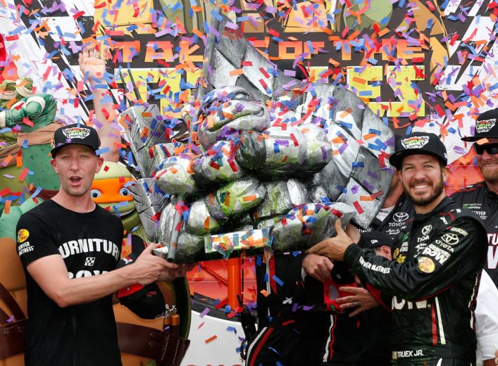 JOLIET, IL - SEPTEMBER 17:  Martin Truex Jr., driver of the #78 Furniture Row/Denver Mattress Toyota, and his crew chief, Cole Pearn, celebrate in Victory Lane after winning the Monster Energy NASCAR Cup Series Tales of the Turtles 400 at Chicagoland Speedway on September 17, 2017 in Joliet, Illinois.  (Photo by Brian Lawdermilk/Getty Images) | Getty Images