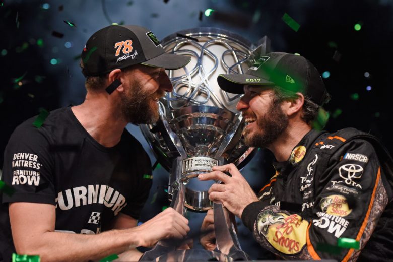 HOMESTEAD, FL - NOVEMBER 19:  Martin Truex Jr., driver of the #78 Bass Pro Shops/Tracker Boats Toyota, celebrates with crew chief Cole Pearn and the trophy in Victory Lane after winning the Monster Energy NASCAR Cup Series Championship and the Monster Energy NASCAR Cup Series Championship Ford EcoBoost 400 at Homestead-Miami Speedway on November 19, 2017 in Homestead, Florida.  (Photo by Jared C. Tilton/Getty Images) | Getty Images