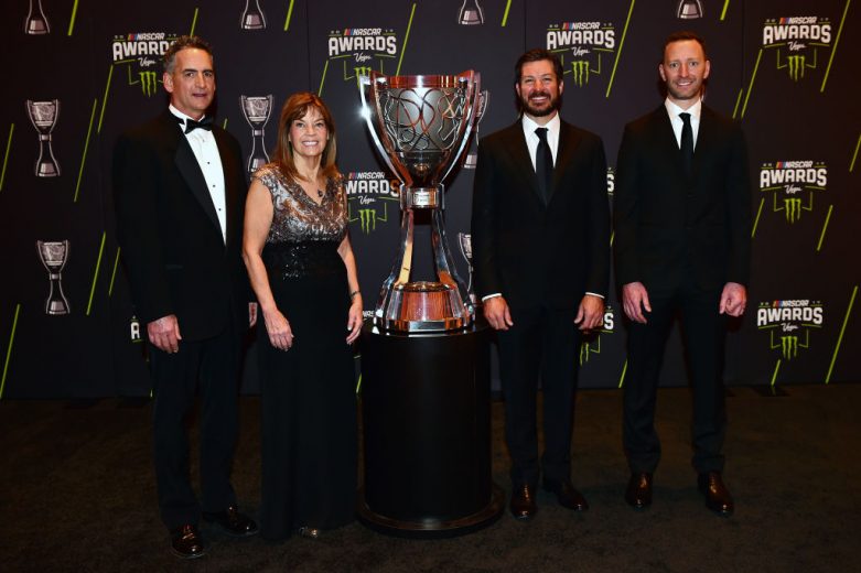 LAS VEGAS, NV - NOVEMBER 30:  (L-R) Furniture Row Racing team president Joe Garone, Carolyn Visser, wife of Furniture Row Racing team owner Barney Visser (not pictured), Monster Energy NASCAR Cup Series Champion Martin Truex Jr., and Monster Energy NASCAR Cup Series Champion crew chief Cole Pearn pose for a photo opportunity prior to the Monster Energy NASCAR Cup Series awards at Wynn Las Vegas on November 30, 2017 in Las Vegas, Nevada.  (Photo by Jared C. Tilton/Getty Images) | Getty Images