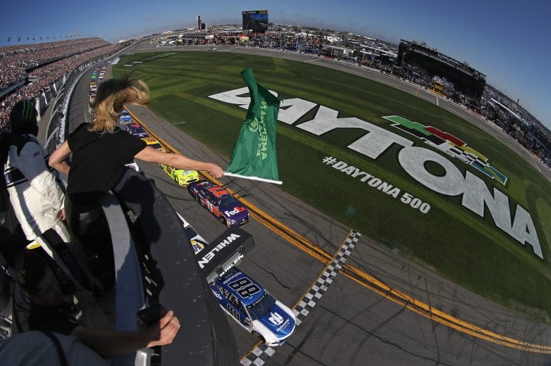 DAYTONA BEACH, FL - FEBRUARY 18:  Actress Charlize Theron waves the green flag to start the Monster Energy NASCAR Cup Series 60th Annual Daytona 500 at Daytona International Speedway on February 18, 2018 in Daytona Beach, Florida.  (Photo by Sean Gardner/Getty Images) | Getty Images