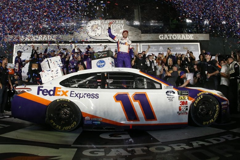 DAYTONA BEACH, FL - FEBRUARY 17:  Denny Hamlin, driver of the #11 FedEx Express Toyota, celebrates in victory lane after winning the Monster Energy NASCAR Cup Series 61st Annual Daytona 500 at Daytona International Speedway on February 17, 2019 in Daytona Beach, Florida.  (Photo by Chris Graythen/Getty Images) | Getty Images