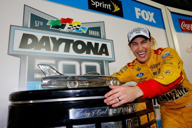 DAYTONA BEACH, FL - FEBRUARY 22:  Joey Logano, driver of the #22 Shell Pennzoil Ford, holds The Harley J. Earl Trophy after winning the NASCAR Sprint Cup Series 57th Annual Daytona 500 at Daytona International Speedway on February 22, 2015 in Daytona Beach, Florida.  (Photo by Chris Trotman/NASCAR via Getty Images)