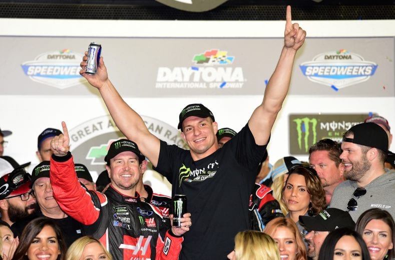 DAYTONA BEACH, FL - FEBRUARY 26:  Kurt Busch, driver of the #41 Haas Automation/Monster Energy Ford, celebrates in Victory Lane with New England Patriots tight end Rob Gronkowski after winning the 59th Annual DAYTONA 500 at Daytona International Speedway on February 26, 2017 in Daytona Beach, Florida.  (Photo by Jared C. Tilton/Getty Images) | Getty Images