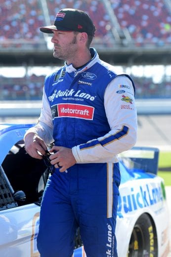 TALLADEGA, AL - APRIL 27: Paul Menard, driver of the #21 Quick Land Tire & Auto Center Ford, stands on the grid during qualifying for the Monster Energy NASCAR Cup Series GEICO 500 at Talladega Superspeedway on April 27, 2019 in Talladega, Alabama. (Photo by Jared C. Tilton/Getty Images) | Getty Images