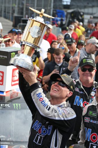 INDIANAPOLIS, INDIANA - SEPTEMBER 08: Kevin Harvick, driver of the #4 Mobil 1 Ford, celebrates in Victory Lane after winning the Monster Energy NASCAR Cup Series Big Machine Vodka 400 at the Brickyard at Indianapolis Motor Speedway on September 08, 2019 in Indianapolis, Indiana. (Photo by Matt Sullivan/Getty Images) | Getty Images