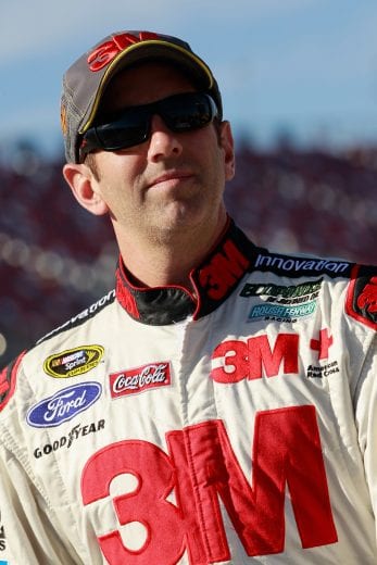 TALLADEGA, AL - OCTOBER 18: Greg Biffle, driver of the #16 3M Ford, stands on the grid during qualifying for the NASCAR Sprint Cup Sereies GEICO 500 at Talladega Superspeedway on October 18, 2014 in Talladega, Alabama. (Photo by Brian Lawdermilk/NASCAR via Getty Images)