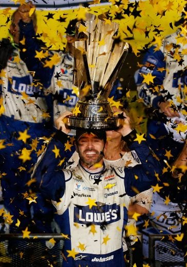 HOMESTEAD, FL - NOVEMBER 20: Jimmie Johnson, driver of the #48 Lowe's Chevrolet, celebrates with the NASCAR Sprint Cup Series Championship trophy in Victory Lane after winning the NASCAR Sprint Cup Series Ford EcoBoost 400 and the 2016 NASCAR Sprint Cup Series Championship at Homestead-Miami Speedway on November 20, 2016 in Homestead, Florida. Johnson wins a record-tying 7th NASCAR title. (Photo by Chris Trotman/Getty Images) | Getty Images